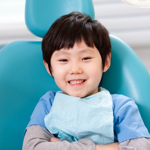 Child smiling after silver diamine fluoride treatment