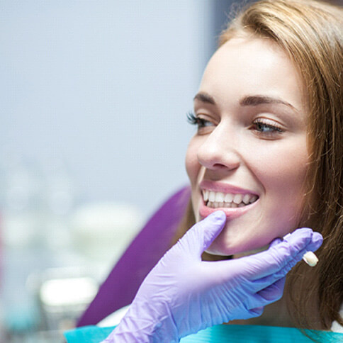 woman having her teeth examined by dentist in arlington