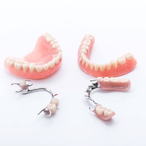 Full and partial dentures against neutral background