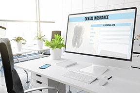 Dental insurance form on desktop in office