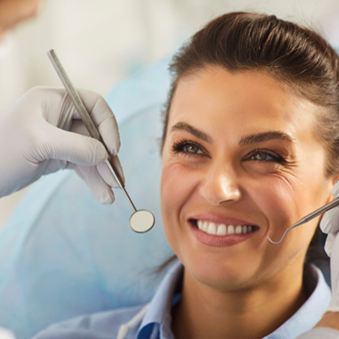 Gum recontouring works by permanently removing excess gum tissue