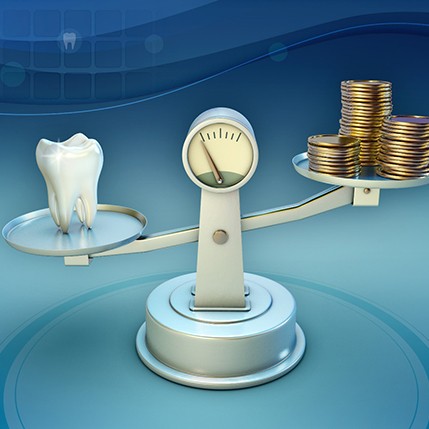 Tooth and coins on a balance scale