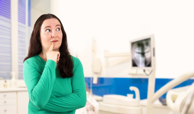 A woman in a dentist’s office looking off to the side