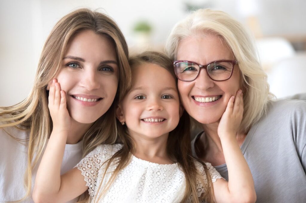 Three generations of women smiling